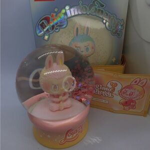 Crystal Ball Big into Energy Pink and Yellow Snow Globe